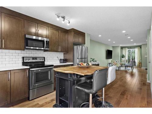 206-2400 Ravenswood View Se, Airdrie, AB - Indoor Photo Showing Kitchen With Upgraded Kitchen