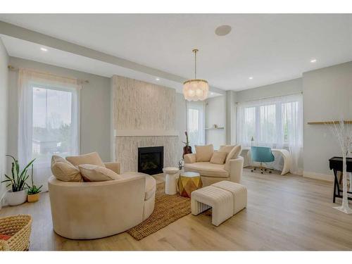 41 Farries Drive Se, Airdrie, AB - Indoor Photo Showing Living Room With Fireplace