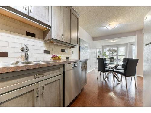 14-635 Marsh Road Ne, Calgary, AB - Indoor Photo Showing Kitchen With Double Sink