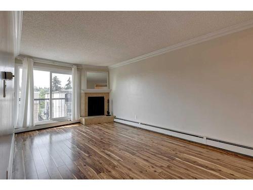 403-1817 11 Avenue Sw, Calgary, AB - Indoor With Fireplace