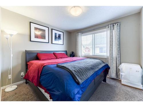 225 New Brighton Row Se, Calgary, AB - Indoor Photo Showing Bedroom