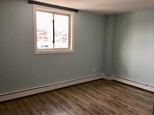 211-1411 7 Avenue Nw, Calgary, AB - Indoor Photo Showing Other Room