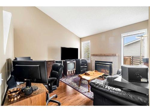 84 River Rock Circle Se, Calgary, AB - Indoor Photo Showing Other Room With Fireplace