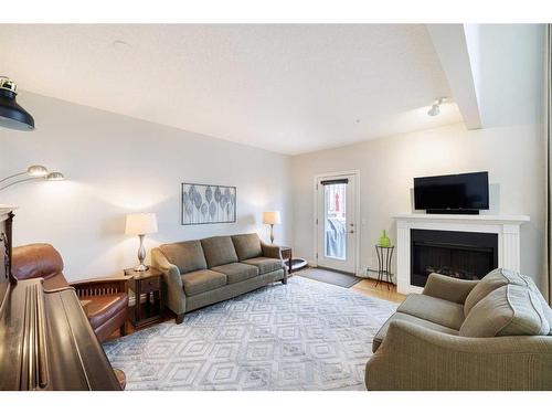 1307-10221 Tuscany Boulevard Nw, Calgary, AB - Indoor Photo Showing Living Room With Fireplace