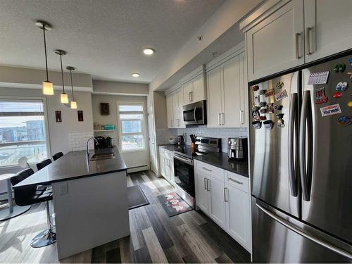 409-300 Harvest Hills Place Ne, Calgary, AB - Indoor Photo Showing Kitchen With Upgraded Kitchen