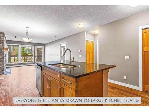 120-106 Stewart Creek Landing, Canmore, AB - Indoor Photo Showing Kitchen With Double Sink
