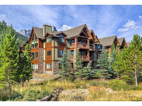 120-106 Stewart Creek Landing, Canmore, AB - Outdoor With Facade