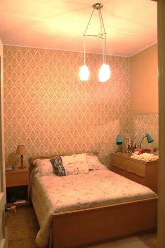 412 Marten Street, Banff, AB - Indoor Photo Showing Bedroom
