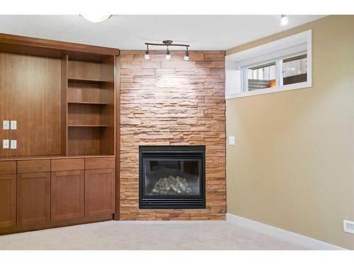 320 Cresthaven Place Sw, Calgary, AB - Indoor Photo Showing Other Room With Fireplace