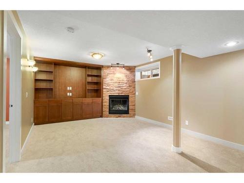 320 Cresthaven Place Sw, Calgary, AB - Indoor With Fireplace