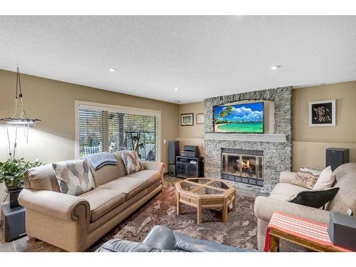 210 Valley Ridge Green Nw, Calgary, AB - Indoor Photo Showing Living Room With Fireplace