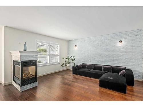 1077 Cranston Drive Se, Calgary, AB - Indoor Photo Showing Living Room With Fireplace