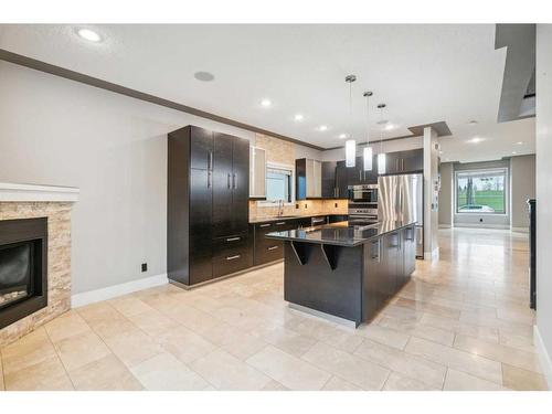 2427 52 Avenue Sw, Calgary, AB - Indoor Photo Showing Kitchen With Fireplace With Upgraded Kitchen