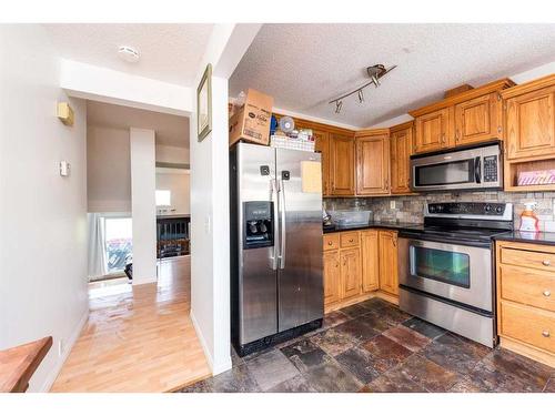 136 Glamis Terrace Sw, Calgary, AB - Indoor Photo Showing Kitchen With Stainless Steel Kitchen