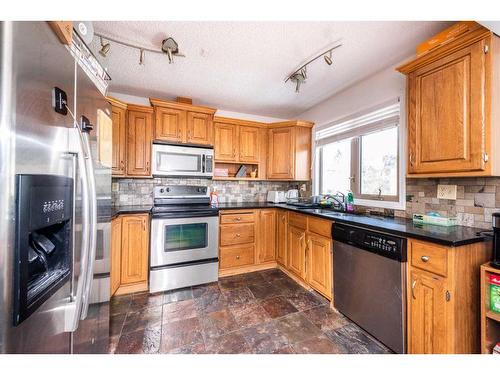 136 Glamis Terrace Sw, Calgary, AB - Indoor Photo Showing Kitchen With Stainless Steel Kitchen With Double Sink