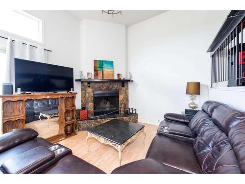 136 Glamis Terrace Sw, Calgary, AB - Indoor Photo Showing Living Room With Fireplace