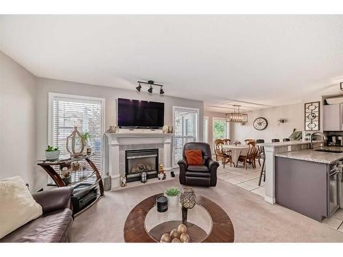 98 Coville Circle Ne, Calgary, AB - Indoor Photo Showing Living Room With Fireplace