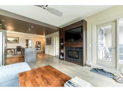 307-1730 5A Street Sw, Calgary, AB - Indoor Photo Showing Living Room With Fireplace