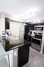 2428-81 Legacy Boulevard Se, Calgary, AB  - Indoor Photo Showing Kitchen With Double Sink 