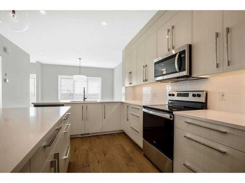 70 Mallard Heath Se, Calgary, AB - Indoor Photo Showing Kitchen With Upgraded Kitchen