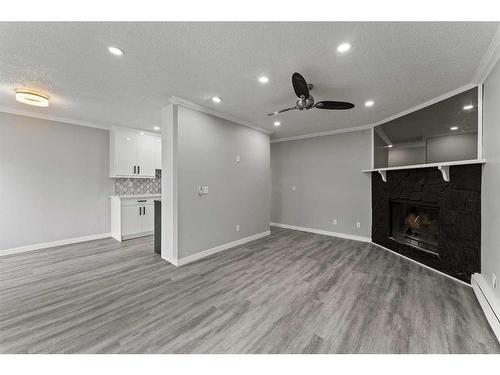 102-917 18 Avenue Sw, Calgary, AB - Indoor With Fireplace