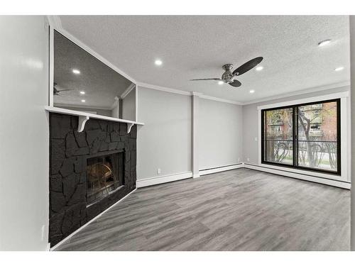 102-917 18 Avenue Sw, Calgary, AB - Indoor With Fireplace