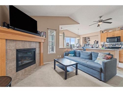 194 Copperfield Gardens Se, Calgary, AB - Indoor Photo Showing Living Room With Fireplace