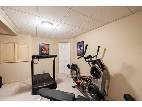 8 Canoe Road Sw, Airdrie, AB - Indoor Photo Showing Gym Room