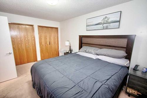 8 Hawkmount Close Nw, Calgary, AB - Indoor Photo Showing Bedroom