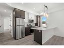 #134-2117 81 Street Sw, Calgary, AB  - Indoor Photo Showing Kitchen With Double Sink With Upgraded Kitchen 