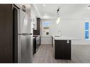 #134-2117 81 Street Sw, Calgary, AB  - Indoor Photo Showing Kitchen With Upgraded Kitchen 