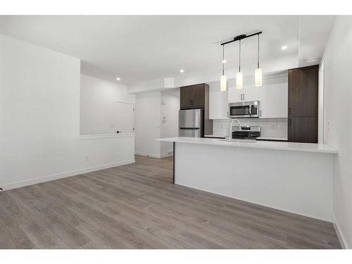 #134-2117 81 Street Sw, Calgary, AB - Indoor Photo Showing Kitchen With Upgraded Kitchen