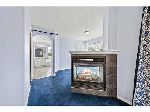 57 Strathlea Court Sw, Calgary, AB - Indoor With Fireplace