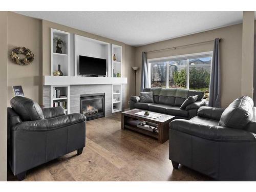51 Sage Bank Court Nw, Calgary, AB - Indoor Photo Showing Living Room With Fireplace