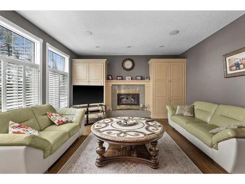 216 Evergreen Heath Sw, Calgary, AB - Indoor Photo Showing Living Room With Fireplace