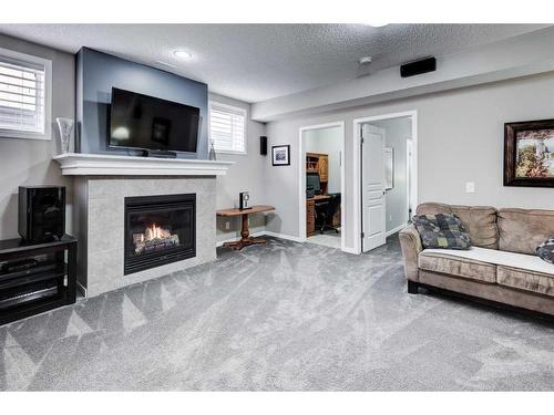 169 Auburn Crest Green Se, Calgary, AB - Indoor Photo Showing Living Room With Fireplace