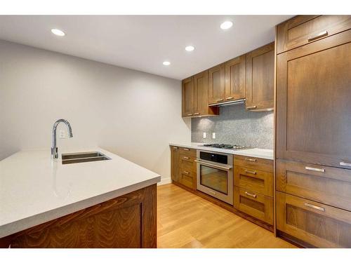 31 Waterfront Mews Sw, Calgary, AB - Indoor Photo Showing Kitchen With Double Sink