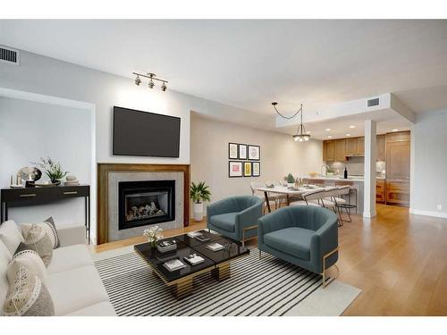 31 Waterfront Mews Sw, Calgary, AB - Indoor Photo Showing Living Room With Fireplace