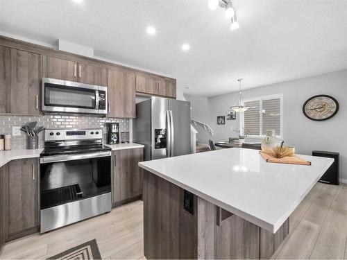 784 Osborne Drive Sw, Airdrie, AB - Indoor Photo Showing Kitchen With Stainless Steel Kitchen With Upgraded Kitchen