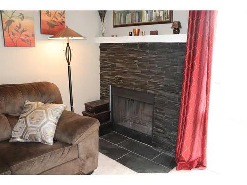 106 Pinemont Bay Ne, Calgary, AB - Indoor With Fireplace