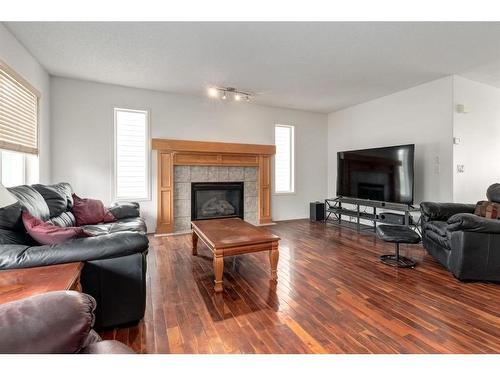 68 Prestwick Cove Se, Calgary, AB - Indoor Photo Showing Living Room With Fireplace