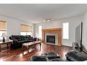 68 Prestwick Cove Se, Calgary, AB  - Indoor Photo Showing Living Room With Fireplace 