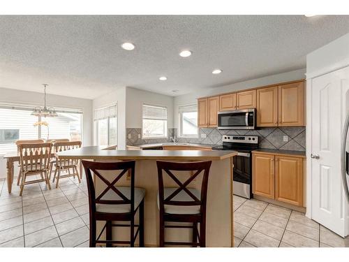 68 Prestwick Cove Se, Calgary, AB - Indoor Photo Showing Kitchen With Double Sink