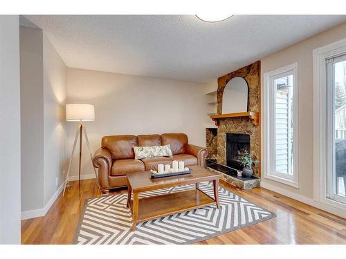 12 Strathcona Crescent Sw, Calgary, AB - Indoor Photo Showing Living Room With Fireplace