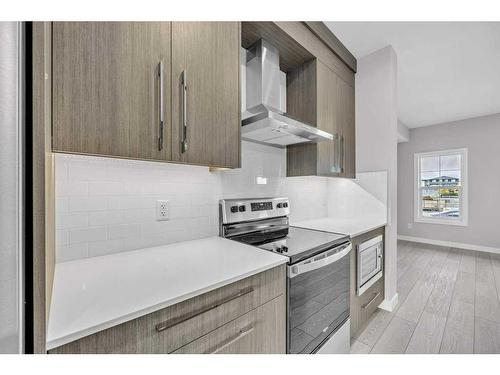 729 Carrington Boulevard, Calgary, AB - Indoor Photo Showing Kitchen With Upgraded Kitchen