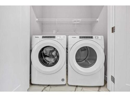 729 Carrington Boulevard, Calgary, AB - Indoor Photo Showing Laundry Room