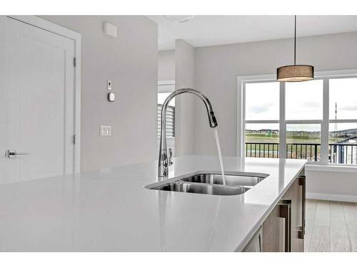 729 Carrington Boulevard, Calgary, AB - Indoor Photo Showing Kitchen With Double Sink