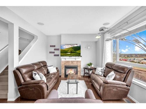 127 Kincora Heath Nw, Calgary, AB - Indoor Photo Showing Living Room With Fireplace