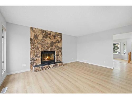 140 Sanderling Rise Nw, Calgary, AB - Indoor Photo Showing Living Room With Fireplace