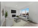 273 Herron Mews Ne, Calgary, AB  - Indoor Photo Showing Living Room With Fireplace 